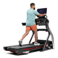 Man using the extended handlebars on the Treadmill 56 --thumbnail